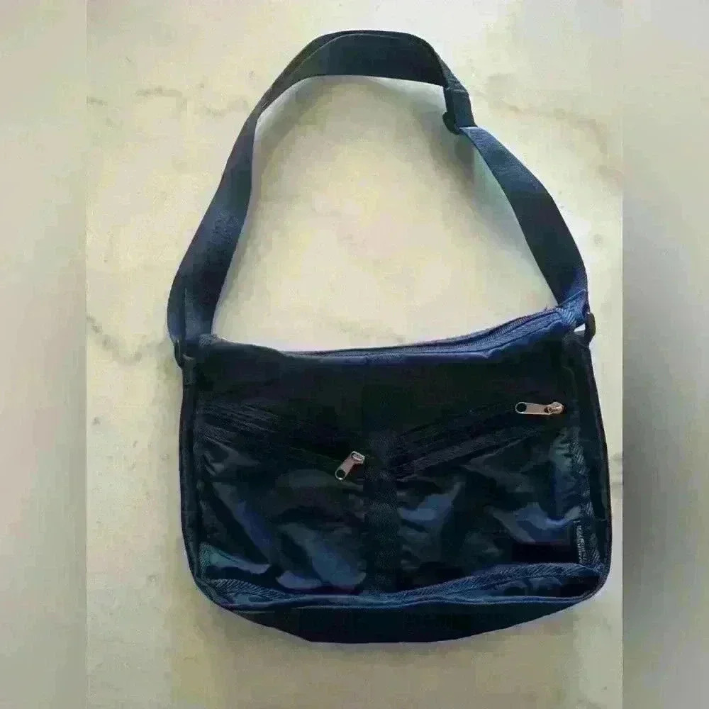 American Tourister dark blue nylon adjustable strap crossbody bag.